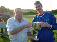 John Kelliher (capt) accepts the cup